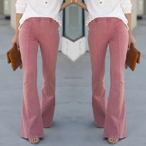 Pink high elastic waist flare denim jeans Anthropologie earrings
